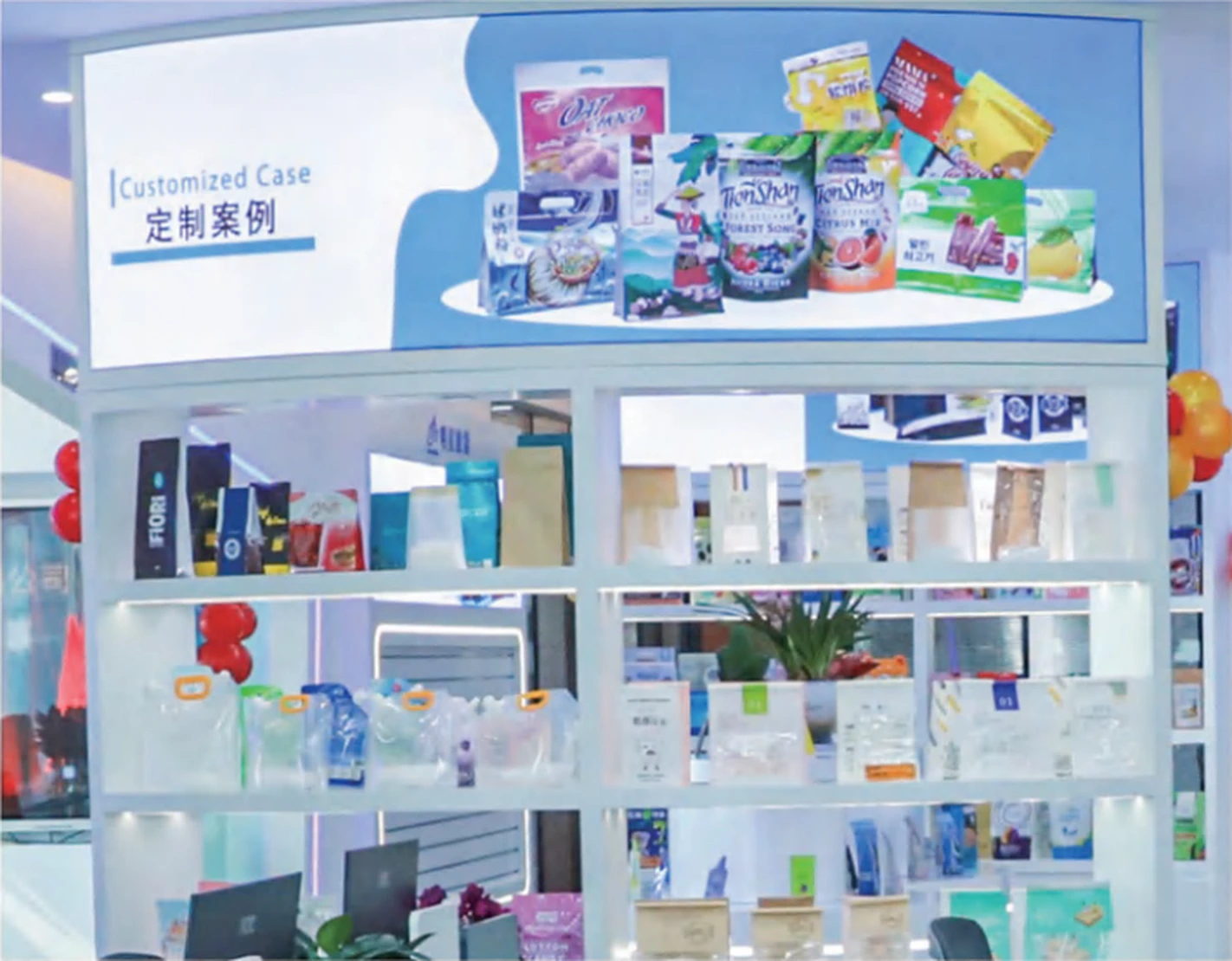 Close view of customized packaging examples on white display shelves